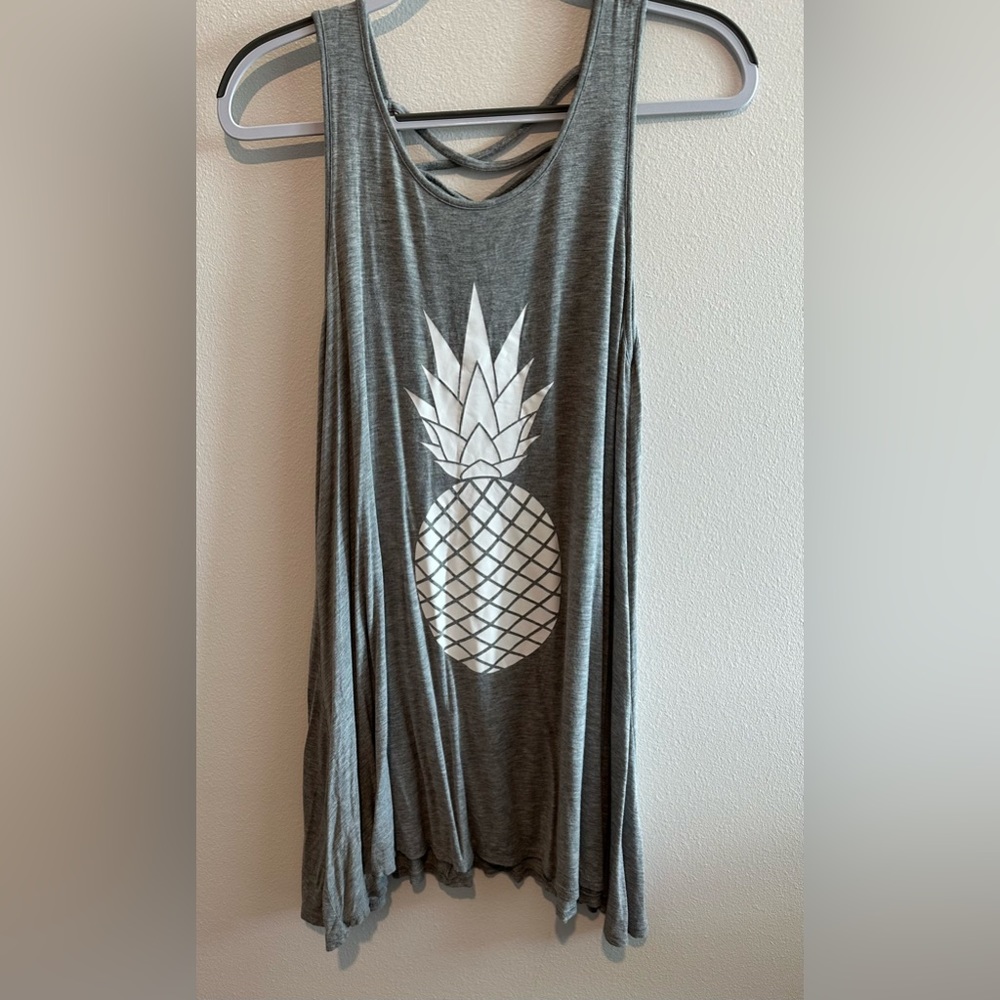Small, gray bathing suit cover-up with a white pineapple on the front.